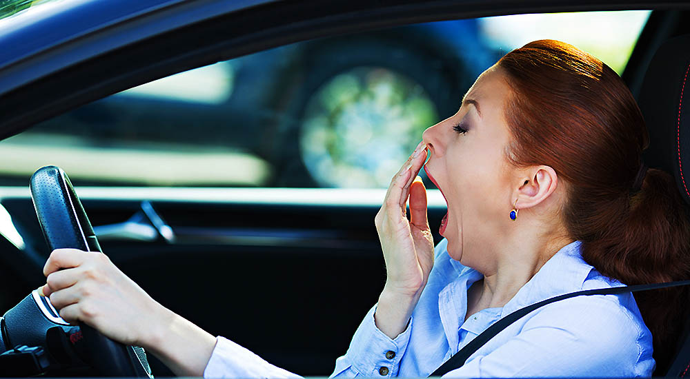 Woman in a car, Tired Stressed, having Trouble Sleeping Adrenal Exhaustion and Chronic Fatigue Syndrome
