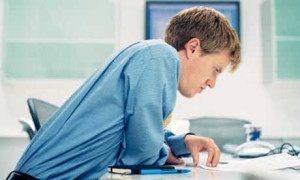 slouching-man-at-desk-optimized